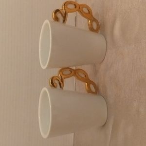 White glossy Preowned Coffee Mugs with "2000" handle design.